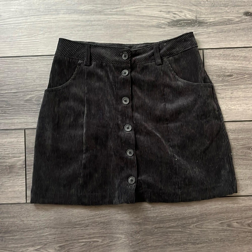 Black corduroy skirt, button down, size M.